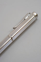 Cap with clip of the Caran d'Ache Ecridor Milanese Mesh fountain pen with an engraved barrel.