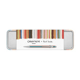 A silver metal tin with the inscription Caran d’Ache + Paul Smith.