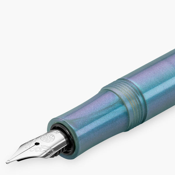 Silver nib featuring the Kaweco logo, paired with a barrel in shimmering shades of blue.