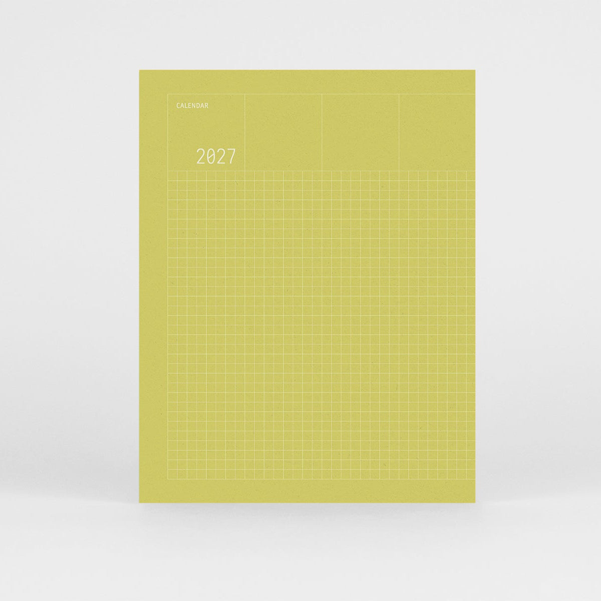 Kalendarz Grid na 2027 rok w kolorze zielonym i srebrnym wzorem w kratkę na okładce.