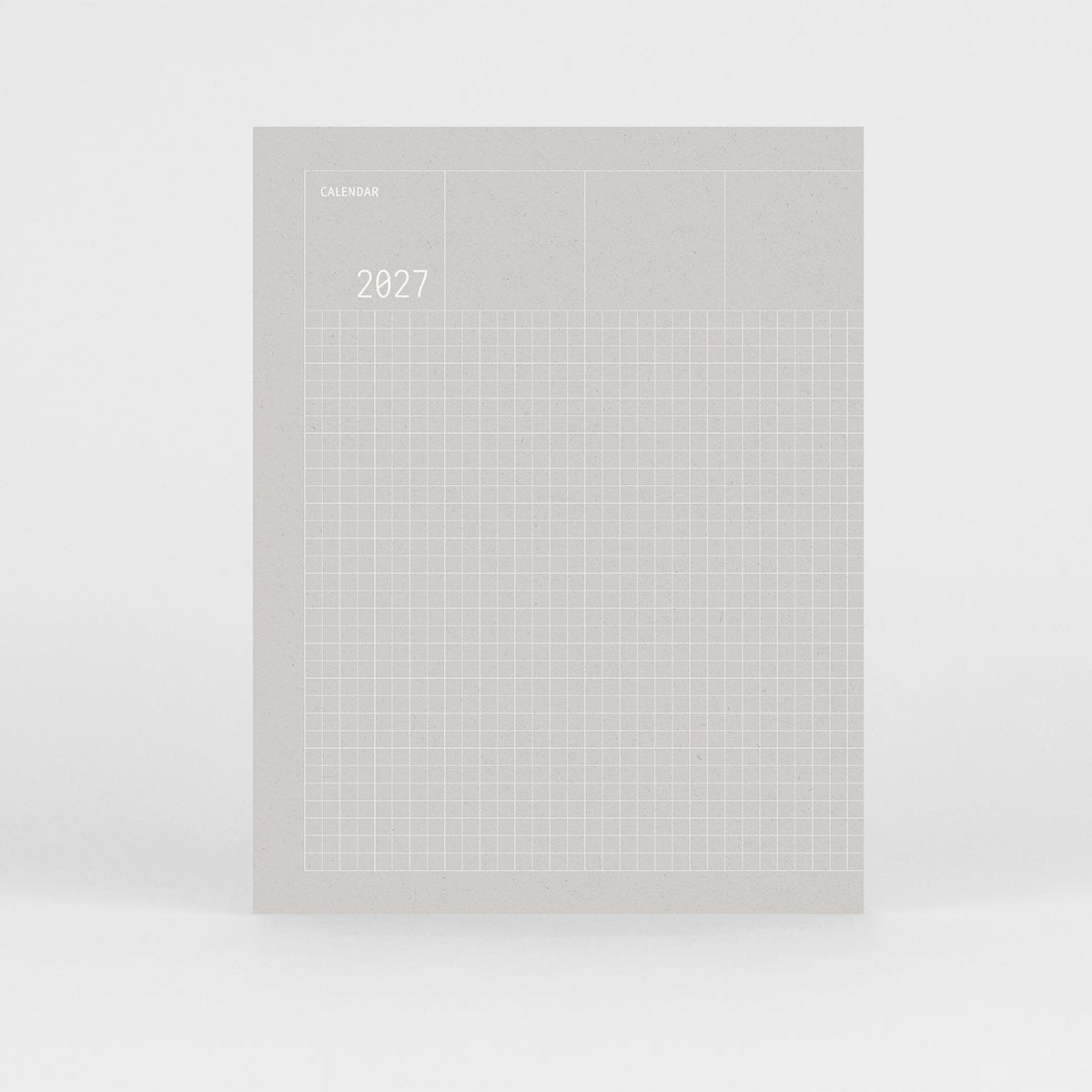 Kalendarz Grid na 2027 rok w kolorze szarym i srebrnym wzorem w kratkę na okładce.