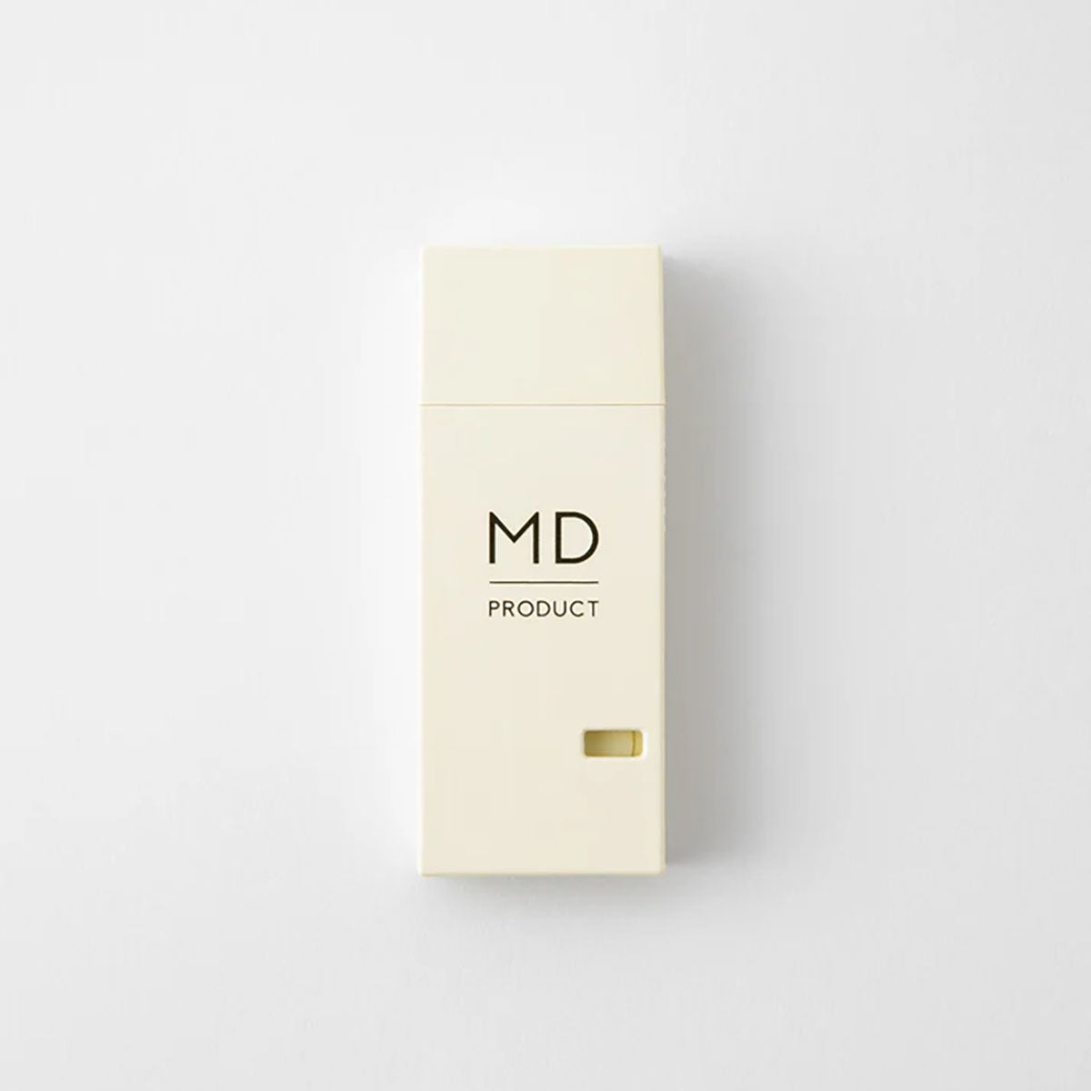 Korektor MD Product w beżowym, prostokątnym opakowaniu i z czarnym napisem MD Product.