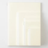 Comparison of five sizes of cream-colored Midori notebooks.