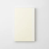 Back cover of a cream-colored notebook by the Japanese brand Midori, featuring an embossed MD Product logo.
