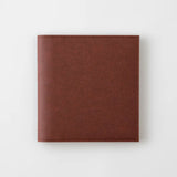 A chocolate-colored paper cover in a square format.