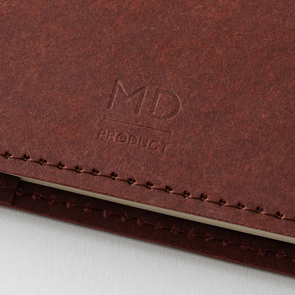 Back of a chocolate-colored Midori cover with an embossed MD Product logo.