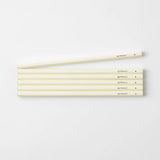 A set of six cream-colored pencils with a black MD Product inscription and a hardness marking of B.
