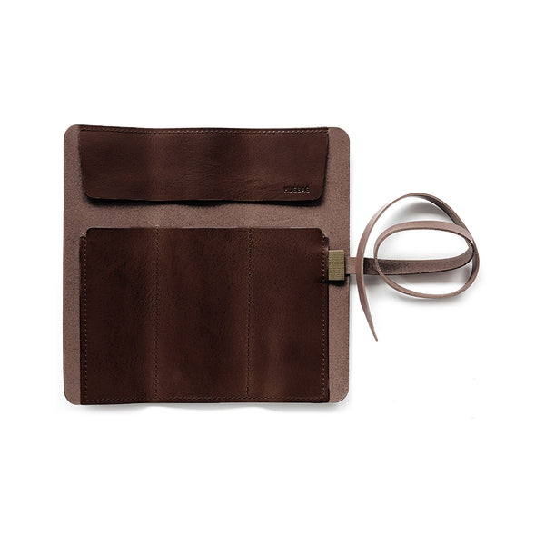 The interior of the Hugbag pen roll features three compartments and a protective flap that helps keep pens securely in place and prevents them from slipping out.