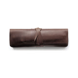 The pencil case filled with writing instruments.