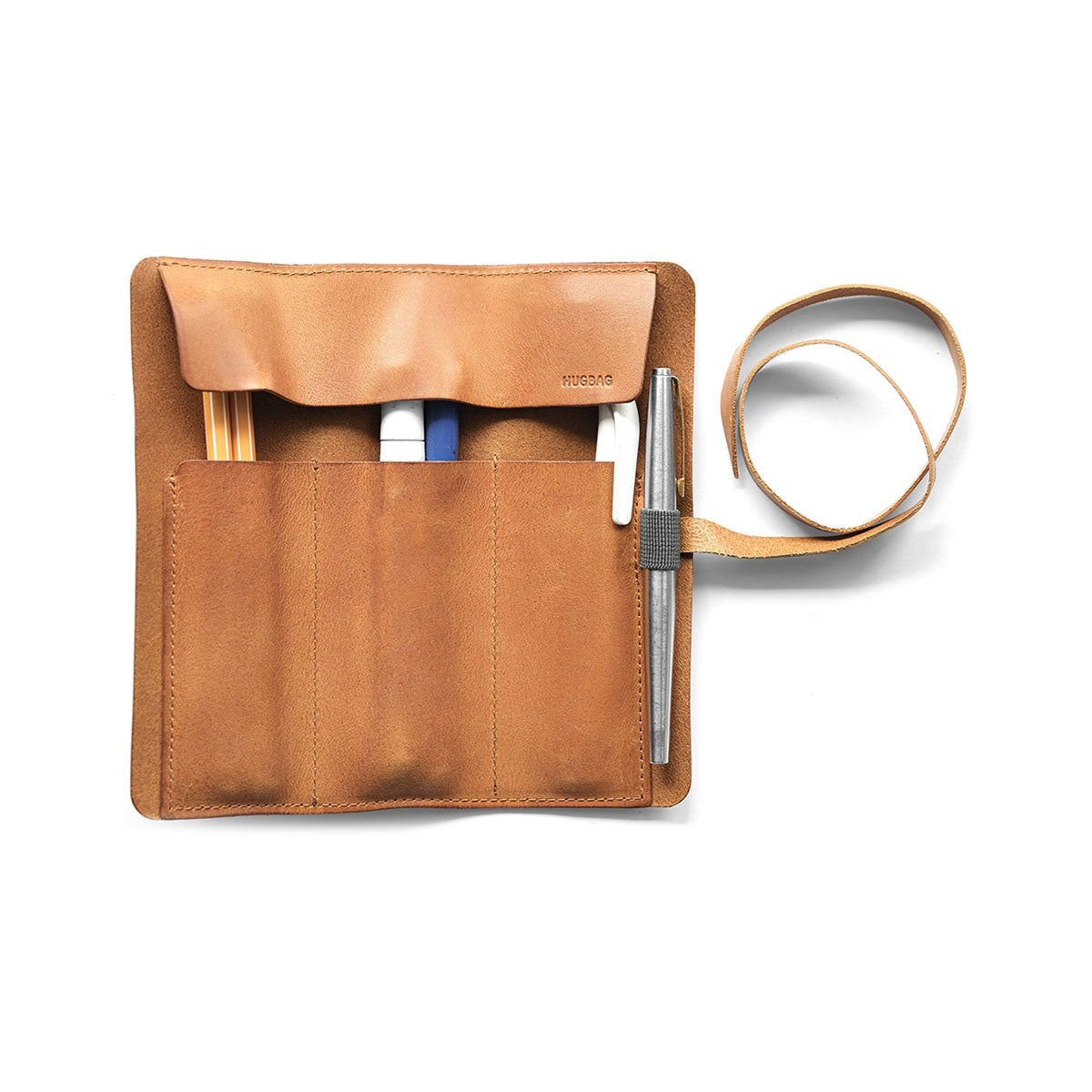 Skórzany piórnik rolowany – koniakowy, HUGBAG, papierniczy design