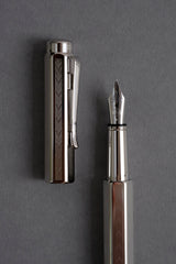 Caran d'Ache Ecridor Chevron fountain pen with a V-shaped engraved pattern.