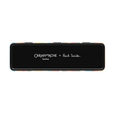 A black metal tin with the inscription Caran d’Ache + Paul Smith.