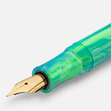 Gold-plated nib with the Kaweco logo, set in a green-toned barrel.
