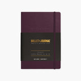 A purple Bullet Journal by Leuchtturm1917 with an elastic band closure.