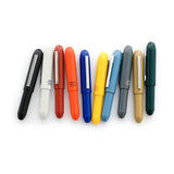Plastic Bullet ballpoint pens by the Penco brand in various colors.