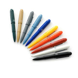 Plastic Bullet ballpoint pens by the Penco brand in various colors.