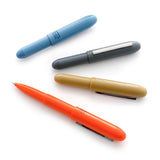 Plastic Bullet ballpoint pens by the Penco brand in light blue, gray, beige, and orange.
