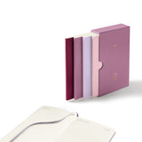 A 2027 quarterly planner consisting of four daily notebooks in a pocket-sized format.