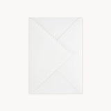 A white envelope included with the greeting card.