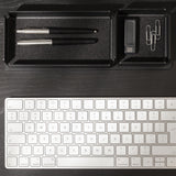 A black steel desk organizer set on a stand. The interior is finished with black felt.
