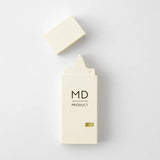 Opened MD Product concealer in a beige, rectangular package with a black MD Product label.