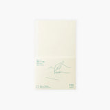 Cover of a cream-colored dotted notebook by the Japanese brand Midori.