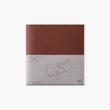 A chocolate-colored paper cover in a square format.