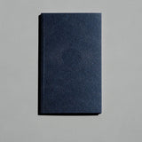 Navy Blue Luna notebook in a soft cover with a dotted new moon pattern and gold speckles.