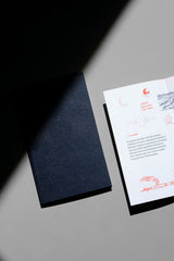 A navy A5 slim-format notebook.