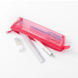 A pink pencil case made from semi-transparent mesh, filled with office supplies.