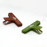Green and burgundy plastic paper clips.