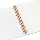 The cream-colored interior of a spiral-bound Penco sketchbook.