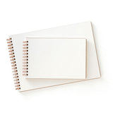 The cream-colored interior of a spiral-bound Penco sketchbook.