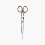 Steel scissors with ivory handles and the Penco brand name engraved on them.